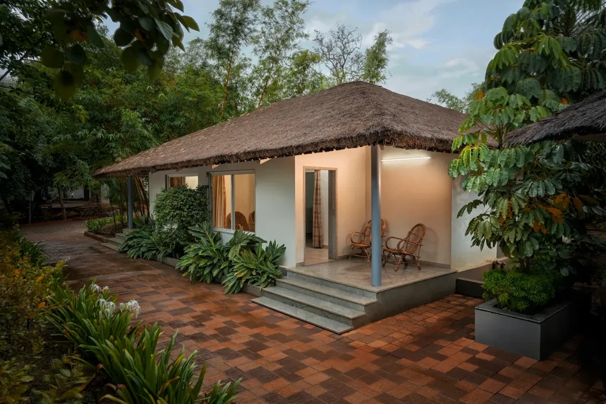 Garden cottage porch with chairs and steps
