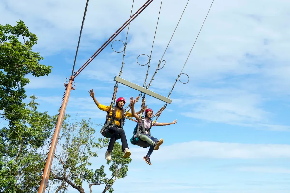 Guests on the giant swing adventure ride